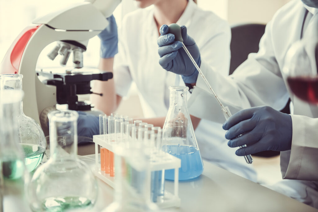 Laboratory staff using pipette and reagents during scientific research – Kelabscience