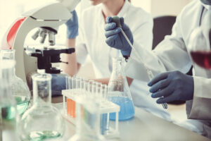 Laboratory staff using pipette and reagents during scientific research – Kelabscience