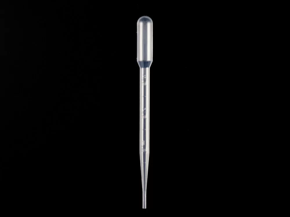 plastic Pasteur pipette on a black background showing the tapered tip and integrated bulb