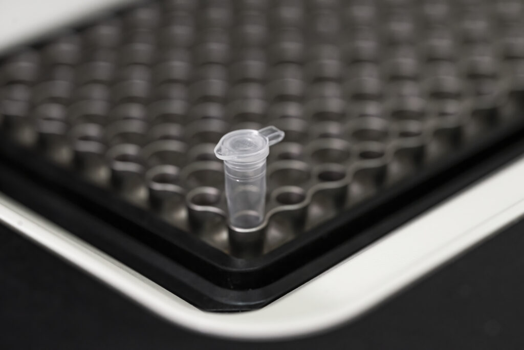 Single microcentrifuge tube placed in multi-well rack for molecular biology workflow setup