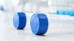 Closed centrifuge tubes with blue screw caps showing subtle cap integrity inspection in routine laboratory use
