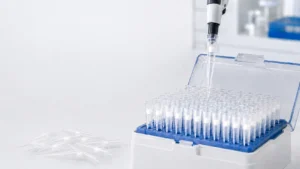 Filter pipette tips in a rack with a micropipette for laboratory sample preparation