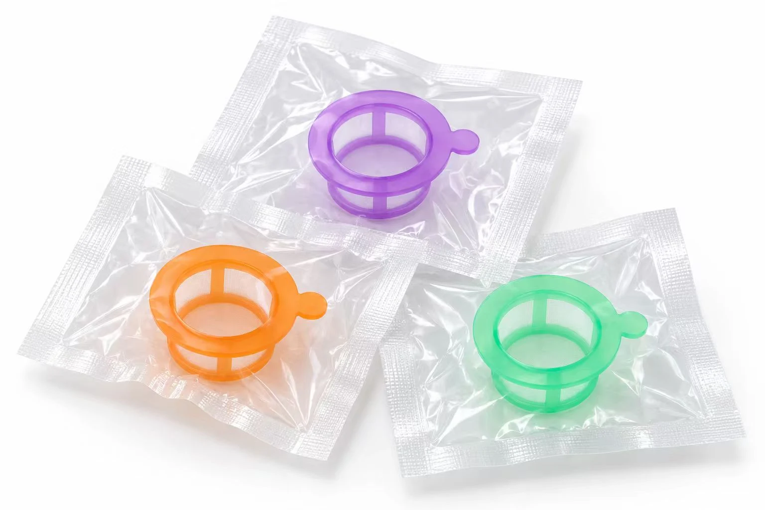 Purple, orange and green nylon mesh cell strainers displayed on packaging pouches
